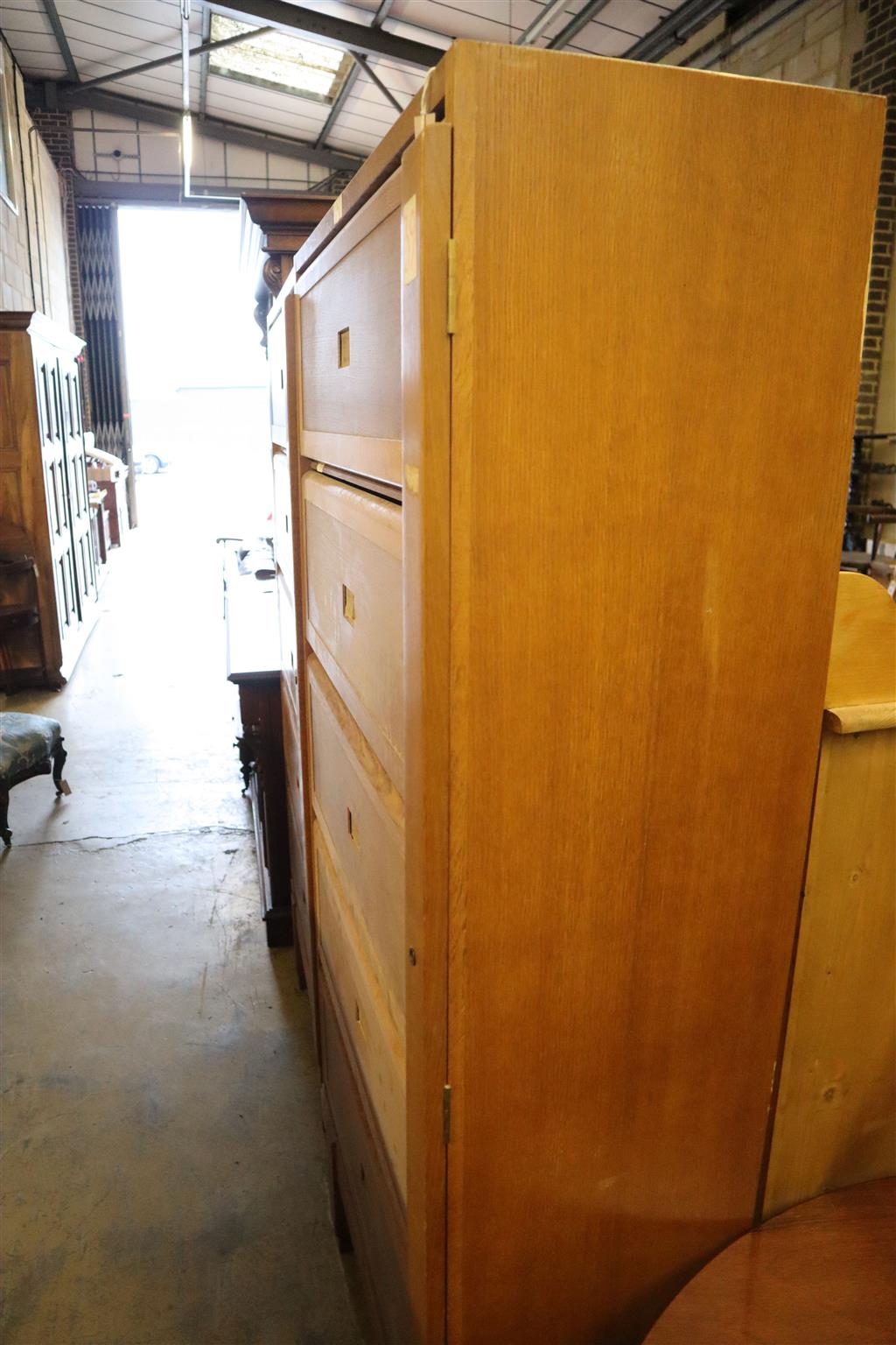 A pair of mid century RAF Staverton oak bookcases, both stencil marked to backs